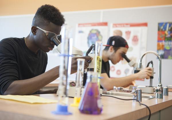 students and microscopes